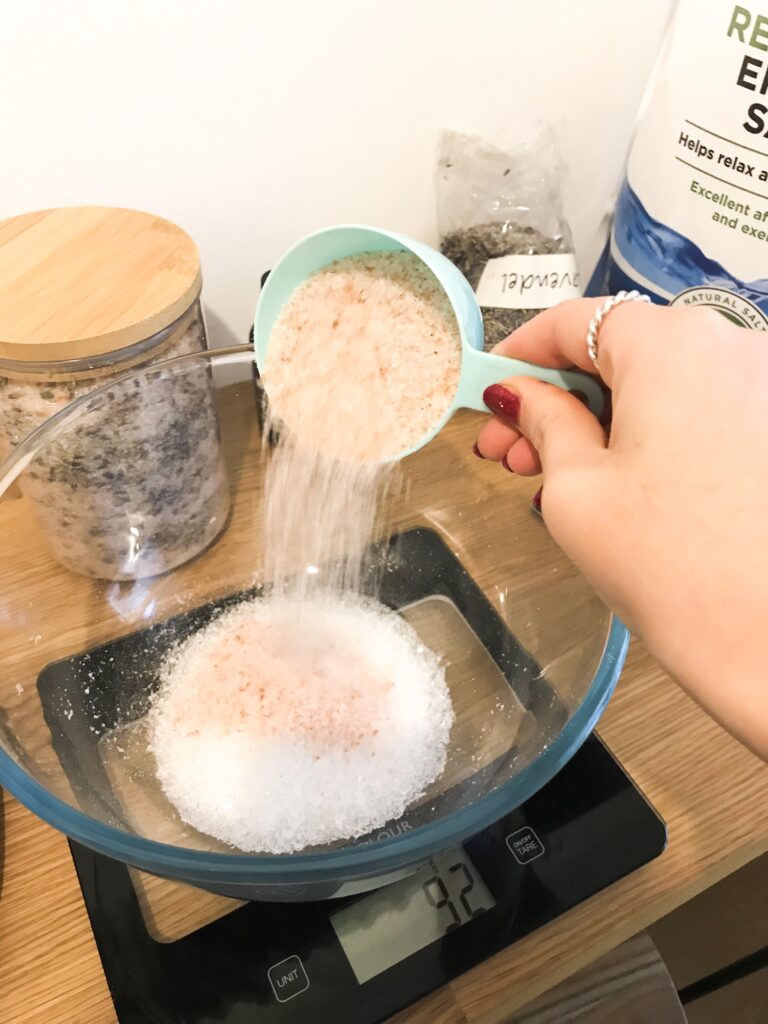 Measuring Epsom and Himalayan salts into a bowl