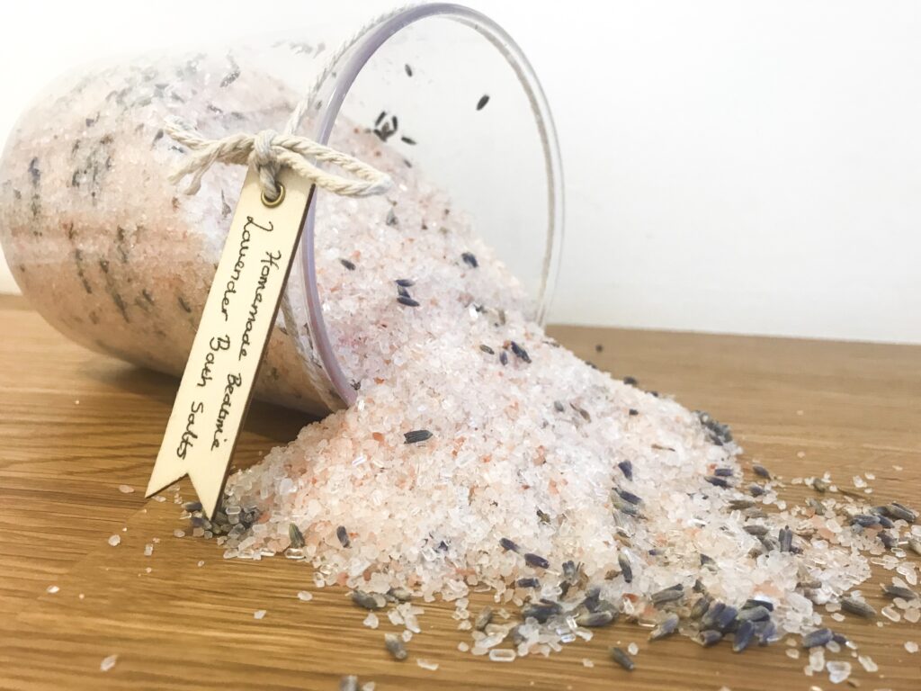Lavender bath salts pouring from a jar