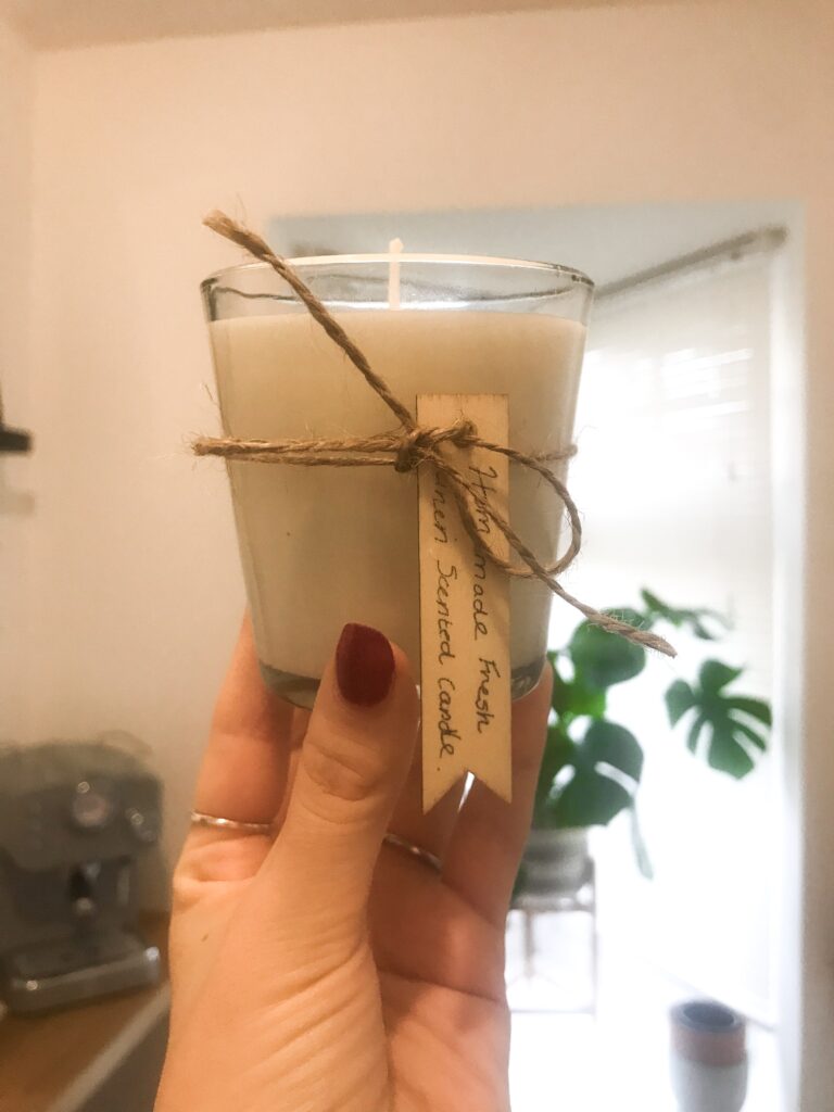 Homemade candle with wooden label